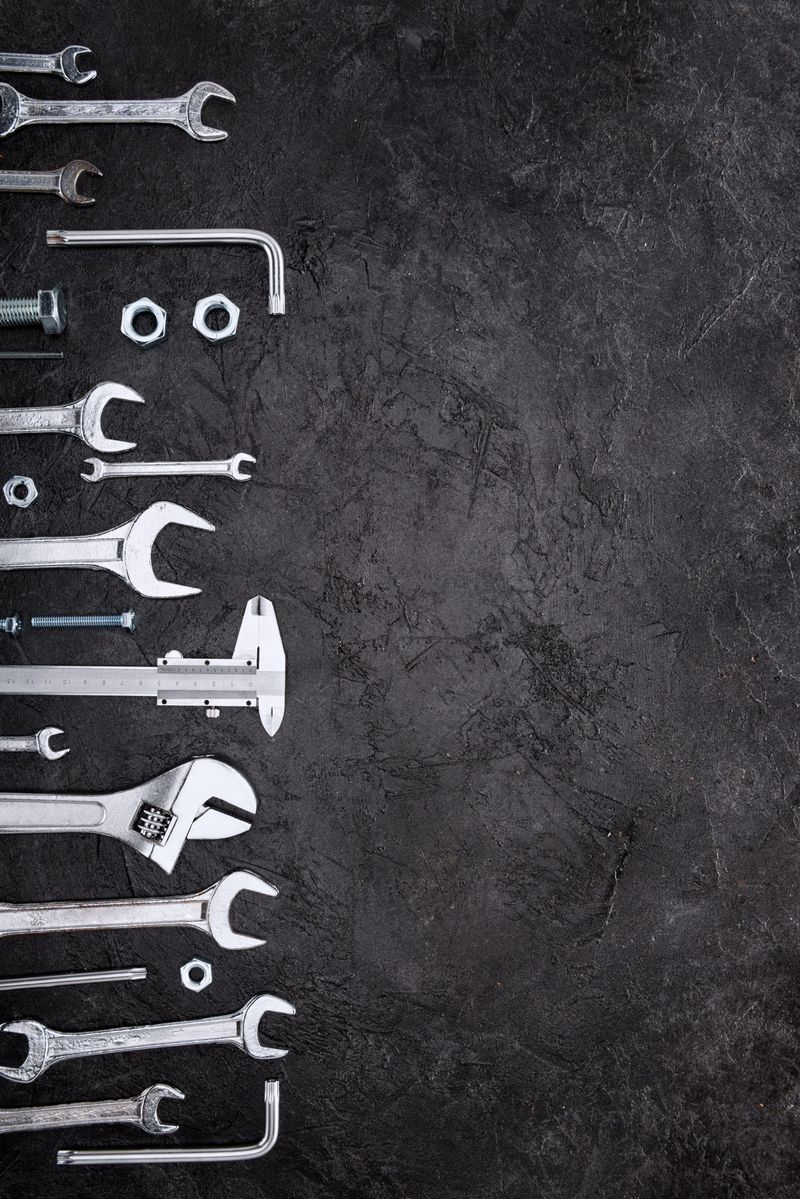 top view of set of various work tools on grey